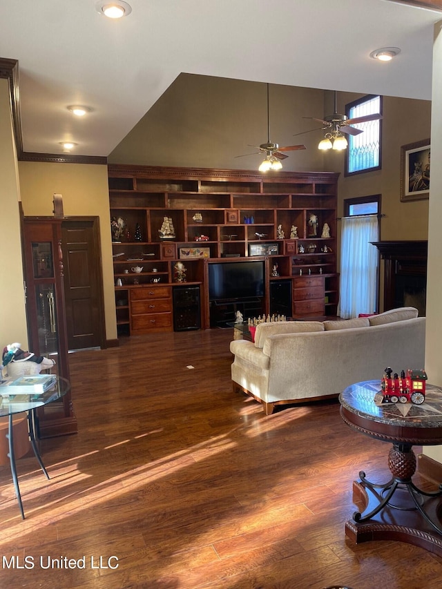 living room featuring hardwood / wood-style flooring and ceiling fan