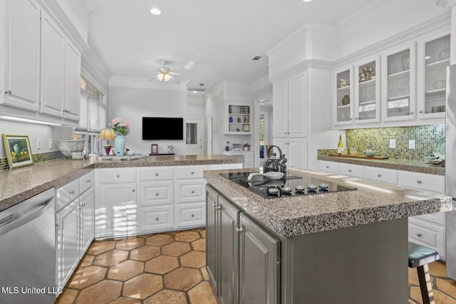 kitchen with a center island, white cabinets, black electric stovetop, stainless steel dishwasher, and ceiling fan