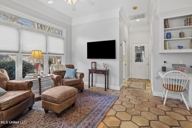 living room featuring ceiling fan and crown molding