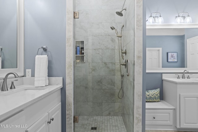 bathroom with vanity and an enclosed shower