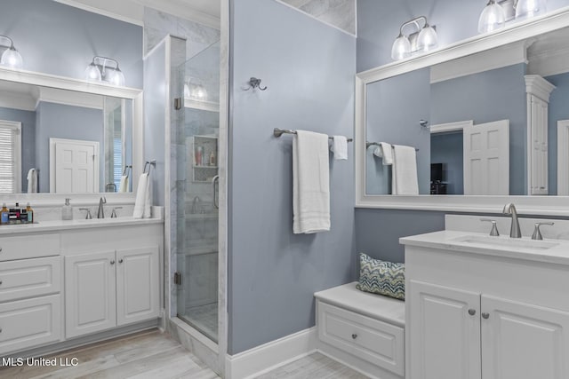 bathroom featuring wood-type flooring, vanity, and a shower with door