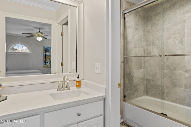 bathroom with shower / bath combination with glass door, ceiling fan, vanity, and ornamental molding