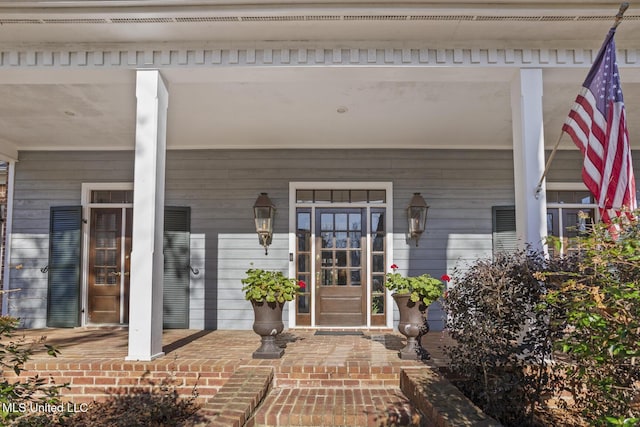 doorway to property with a porch