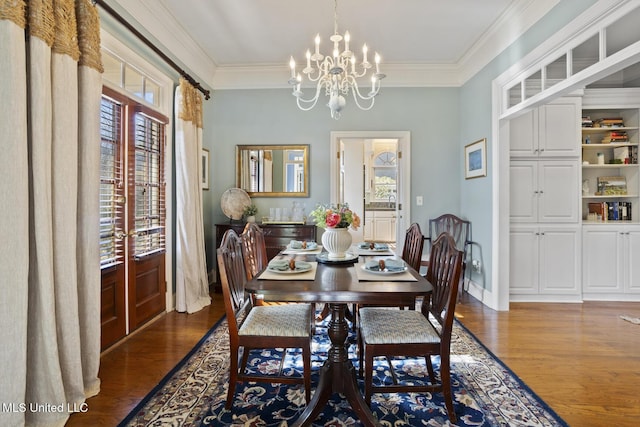 dining room featuring a notable chandelier, crown molding, and dark wood-type flooring