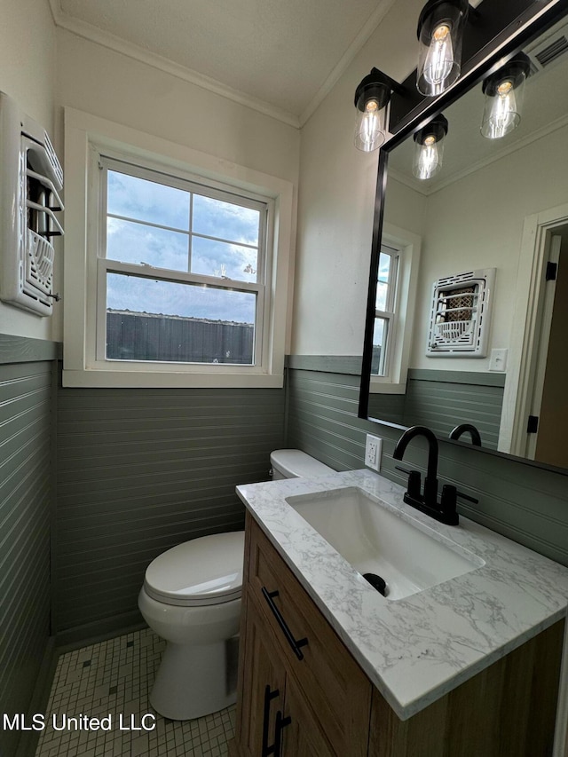 bathroom with tile walls, vanity, toilet, and tile patterned flooring