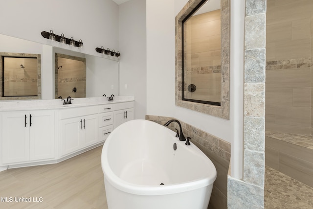 bathroom featuring vanity, tile walls, and plus walk in shower