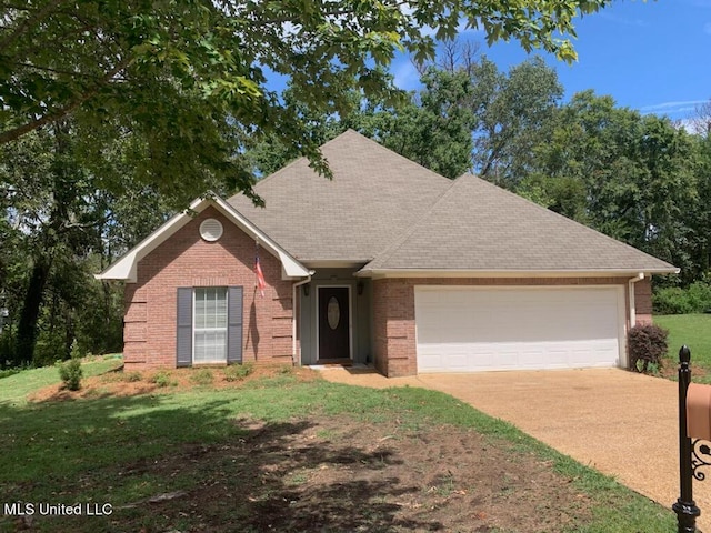 single story home featuring a front yard and a garage