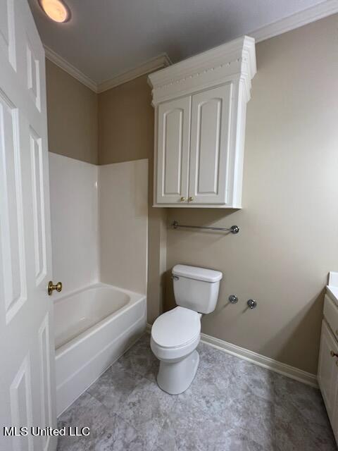 full bathroom featuring toilet, ornamental molding, vanity, and  shower combination