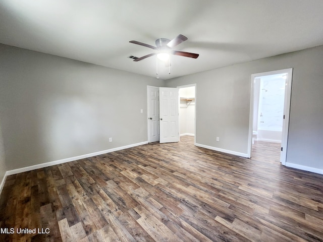 9108 Moser Ave, Vancleave, MS 39565 - unfurnished bedroom with dark wood finished floors, baseboards, ensuite bathroom, ceiling fan, and a closet