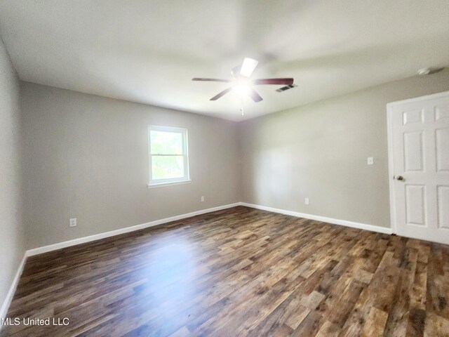 9108 Moser Ave, Vancleave, MS 39565 - spare room with ceiling fan, dark wood finished floors, and baseboards