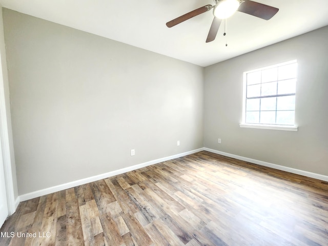 9108 Moser Ave, Vancleave, MS 39565 - empty room with wood finished floors, baseboards, and a ceiling fan