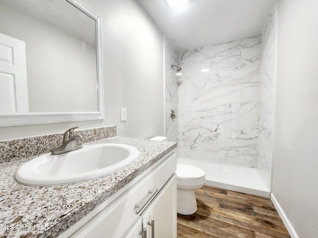 9108 Moser Ave, Vancleave, MS 39565 - bathroom with toilet, a marble finish shower, vanity, and wood finished floors