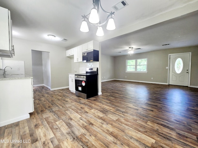 9108 Moser Ave, Vancleave, MS 39565 - kitchen with electric stove, a sink, wood finished floors, and white cabinetry
