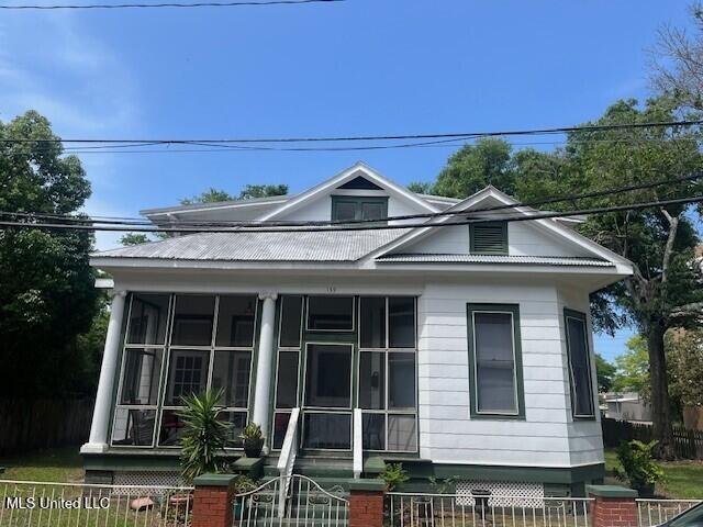 139 Fayard St, Biloxi, MS 39530 - view of front of property featuring a fenced front yard and a sunroom