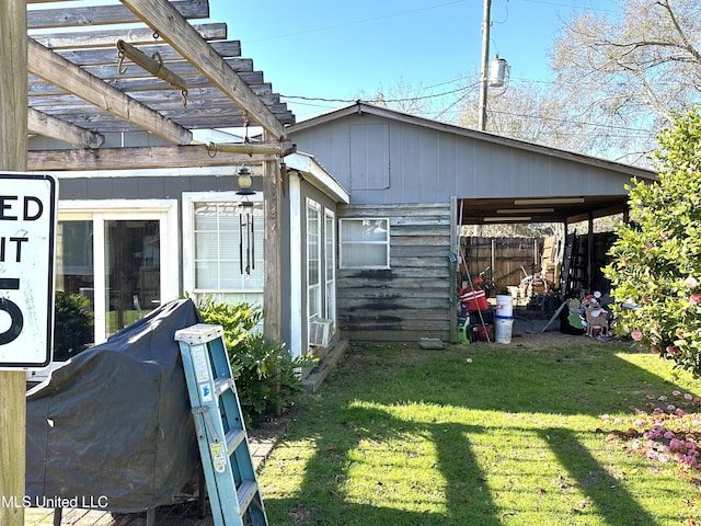 view of home's exterior featuring cooling unit, a pergola, and a yard