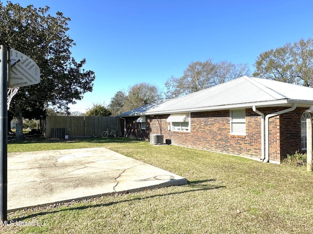 view of yard featuring a patio and central AC unit