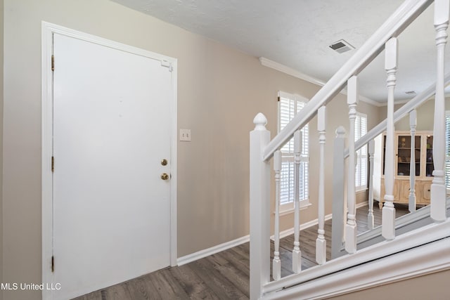 3590 Shady Oaks Dr, Olive Branch, MS 38654 - entryway with wood finished floors, ornamental molding, stairway, and baseboards