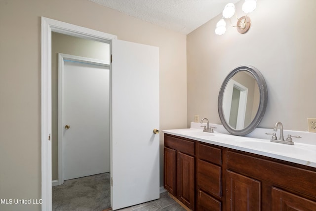 3590 Shady Oaks Dr, Olive Branch, MS 38654 - bathroom featuring double vanity and a textured ceiling