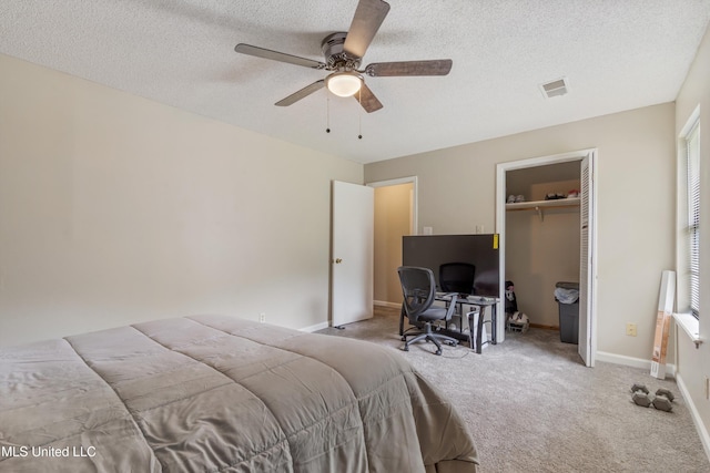 3590 Shady Oaks Dr, Olive Branch, MS 38654 - bedroom featuring carpet floors, a textured ceiling, a closet, ceiling fan, and baseboards