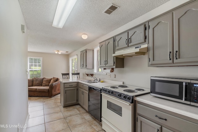 3590 Shady Oaks Dr, Olive Branch, MS 38654 - kitchen with under cabinet range hood, stainless steel microwave, white range with electric cooktop, black dishwasher, and gray cabinets