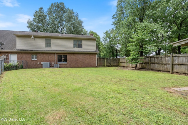 3590 Shady Oaks Dr, Olive Branch, MS 38654 - rear view of house with cooling unit, brick siding, and a chimney