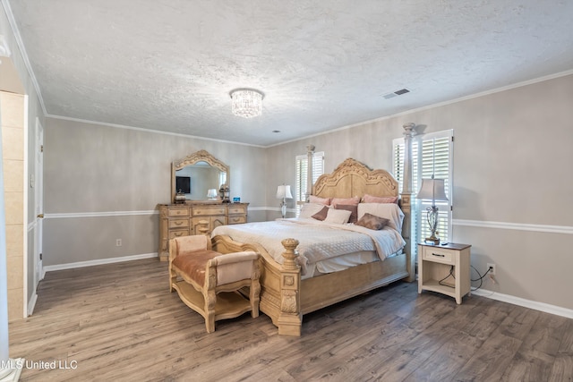 3590 Shady Oaks Dr, Olive Branch, MS 38654 - bedroom with wood finished floors, baseboards, a textured ceiling, a chandelier, and ornamental molding