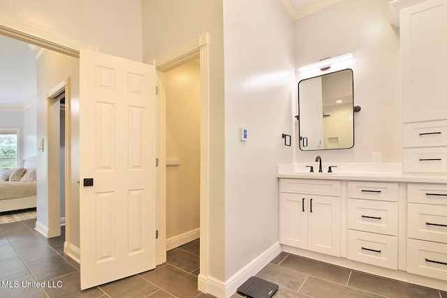 bathroom with vanity, tile patterned floors, and ornamental molding