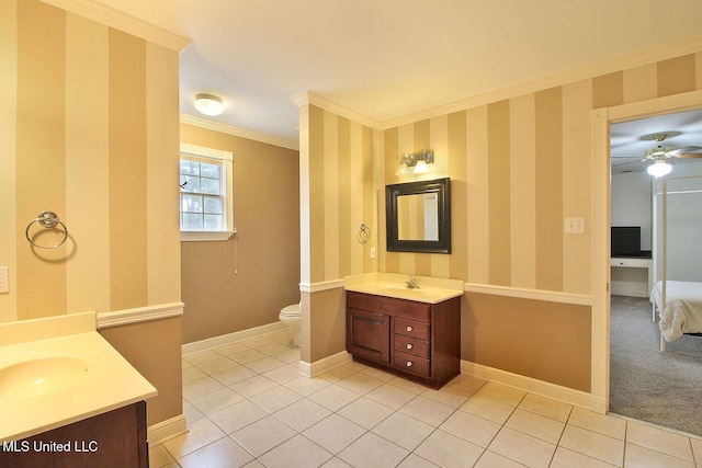 bathroom featuring ceiling fan, tile patterned floors, toilet, vanity, and ornamental molding