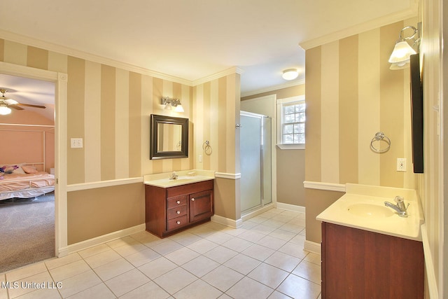 bathroom with vanity, tile patterned floors, crown molding, ceiling fan, and a shower with shower door