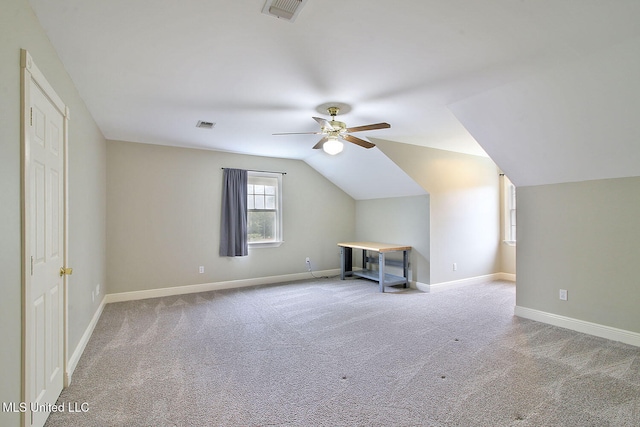 additional living space featuring ceiling fan, carpet, and vaulted ceiling