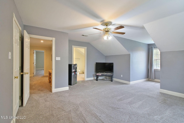 unfurnished living room with light carpet, ceiling fan, and lofted ceiling