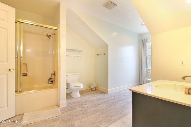 full bathroom featuring wood-type flooring, vanity, toilet, and enclosed tub / shower combo