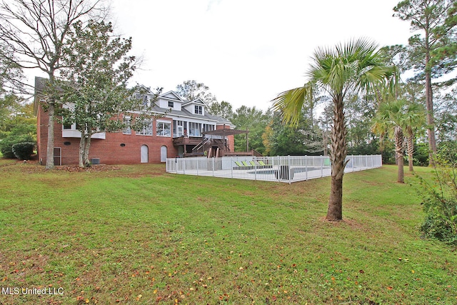 view of yard featuring a pool side deck