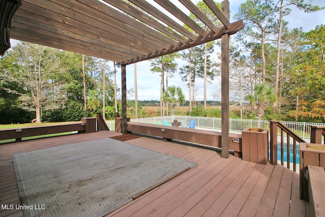 wooden deck with a pergola and a pool