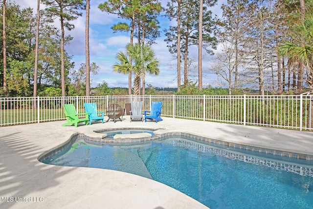 view of pool with an in ground hot tub and a patio area