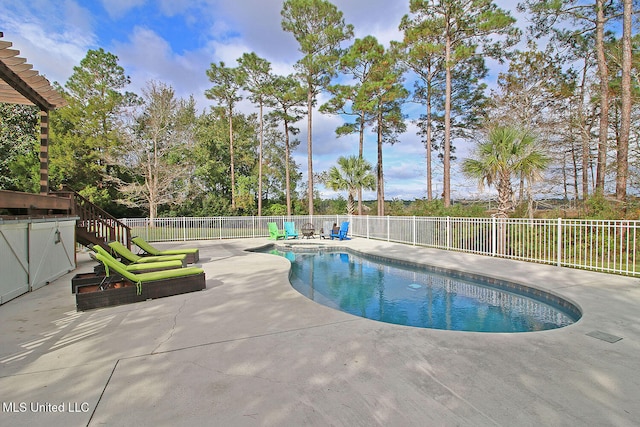 view of swimming pool featuring a patio area