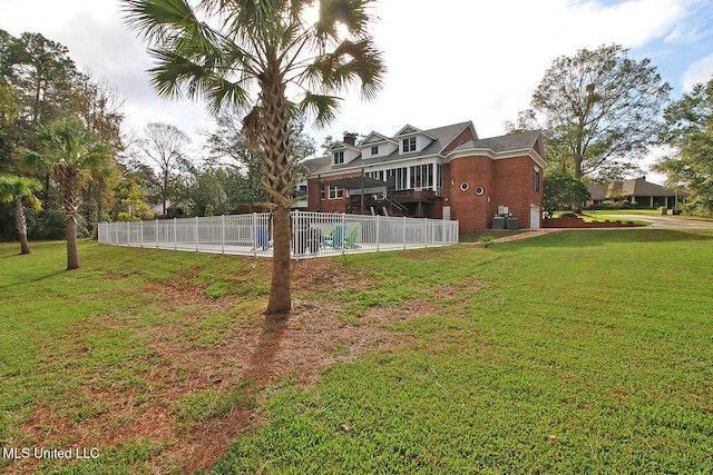 view of yard featuring a fenced in pool