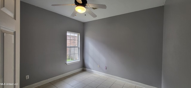 tiled empty room with ceiling fan