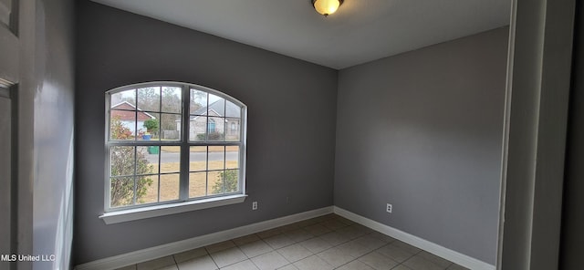 empty room with light tile patterned floors