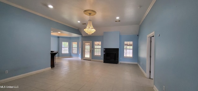 unfurnished living room featuring vaulted ceiling, a chandelier, a healthy amount of sunlight, and crown molding