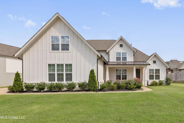 4406 John Wood Ln, Olive Branch, MS 38654 - modern inspired farmhouse with board and batten siding, a standing seam roof, a front lawn, a metal roof, and roof with shingles