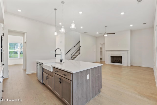 4406 John Wood Ln, Olive Branch, MS 38654 - kitchen featuring ceiling fan, light wood-style flooring, appliances with stainless steel finishes, light countertops, and recessed lighting