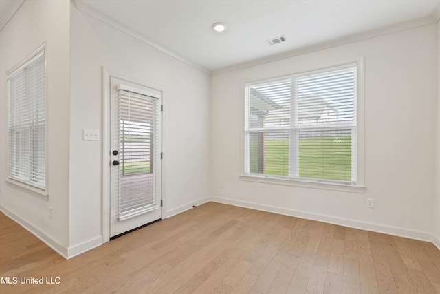 4406 John Wood Ln, Olive Branch, MS 38654 - empty room with plenty of natural light, light wood finished floors, ornamental molding, and recessed lighting