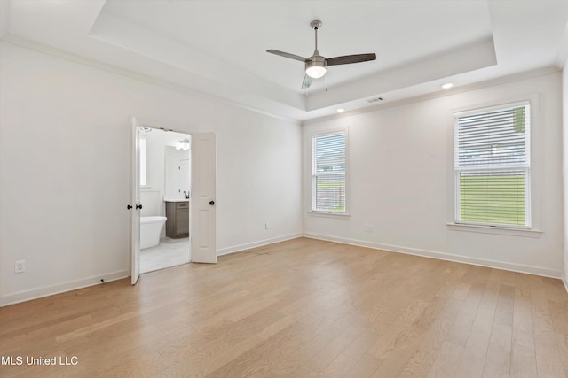 4406 John Wood Ln, Olive Branch, MS 38654 - spare room featuring a raised ceiling, light wood-style floors, ceiling fan, and recessed lighting