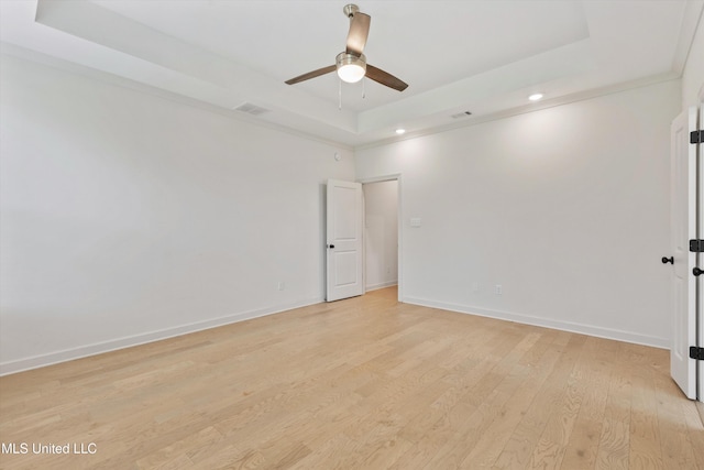 4406 John Wood Ln, Olive Branch, MS 38654 - unfurnished room with a tray ceiling, light wood-style floors, ceiling fan, and recessed lighting