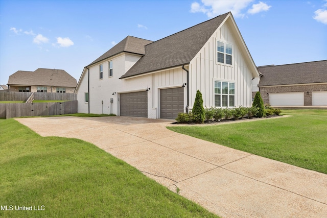 4406 John Wood Ln, Olive Branch, MS 38654 - view of front of home with board and batten siding, concrete driveway, a shingled roof, and an attached garage