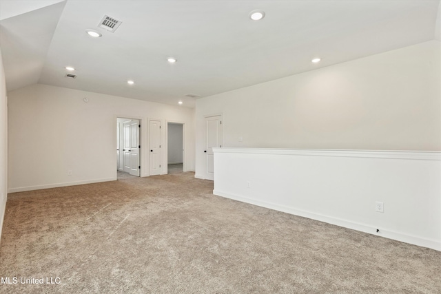 4406 John Wood Ln, Olive Branch, MS 38654 - empty room with light carpet, recessed lighting, and lofted ceiling