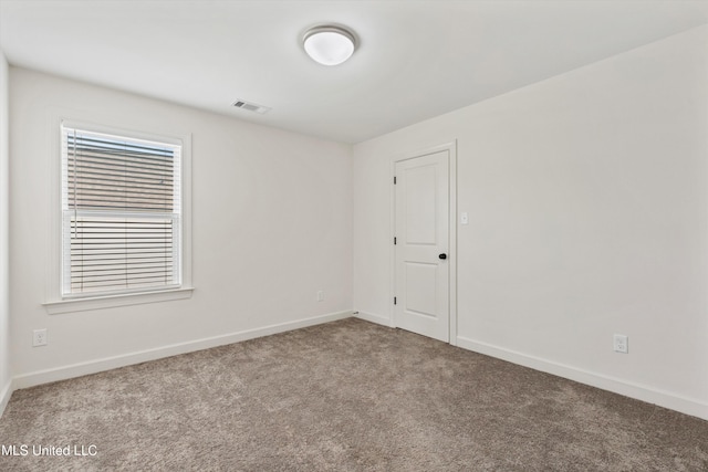 4406 John Wood Ln, Olive Branch, MS 38654 - spare room featuring carpet floors and baseboards