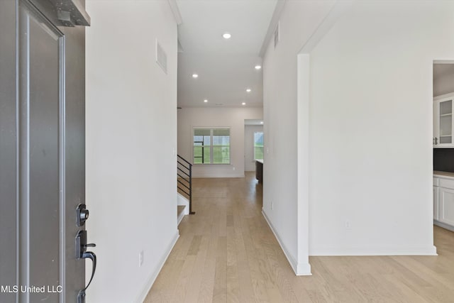 4406 John Wood Ln, Olive Branch, MS 38654 - hallway featuring light wood-style floors, stairs, and recessed lighting