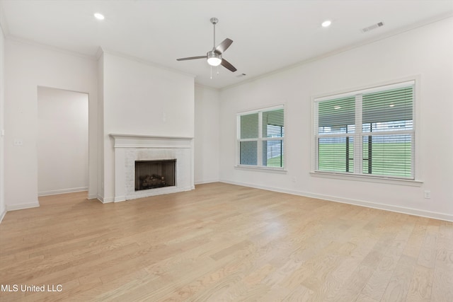 4406 John Wood Ln, Olive Branch, MS 38654 - unfurnished living room with a ceiling fan, ornamental molding, light wood-type flooring, a tile fireplace, and recessed lighting